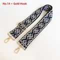 Close-up of geometric pattern nylon bag strap with golden metal lobster clasps and buckle - US 14