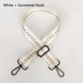 Detail of white nylon bag strap with gold V-pattern and gunmetal swivel snap hooks - White + Gunmetal Hook