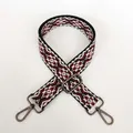 Detail of adjustable geometric weave strap with red, white and black pattern and gunmetal hooks - Leopard Style 3 with Gunmetal Hook