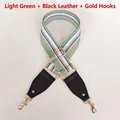 Detail of light green striped canvas bag strap with black leather and gold metal hooks - Light Green with Black Leather and Gold Hook