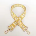 Detail of adjustable wide canvas shoulder strap with yellow geometric patterns and gold buckles - No.6 + Gold Hook