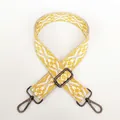 Close-up of jacquard wide purse strap with yellow geometric patterns and gunmetal lobster clasps - No.6 + Gunmetal Hook