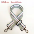 Close-up of 5cm wide striped bag strap with gunmetal hooks and adjustable buckle - Light Green + Gunmetal Hook