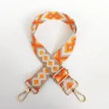 Detail of bohemian geometric orange canvas strap with golden lobster clasps and buckles - Style No.3 (Gold Hook)
