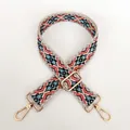 Close-up of ethnic geometric jacquard strap with golden rotating metal hooks and slide buckle - No.9 + Gold Hook