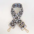 Detail view of retro blue jacquard embroidery bag strap with gold metal lobster clasps - No. 7 (No. 7 + Gold Hook)