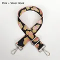 Close-up of pink leopard print bag strap with silver metal hooks and adjustable buckle - Pink Black Gold Leopard + Silver Hook