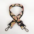 Detail view of adjustable leopard print shoulder strap with gunmetal hardware hooks - Pink Black Gold Leopard + Gunmetal Hook