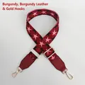 Detail view of adjustable burgundy strap with star pattern and golden swivel snap hooks - Wine Red with Wine Red Leather and Gold Hook