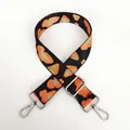 Detail of orange leopard jacquard bag strap with silver metal hooks and buckle - Orange Black Gold Leopard + Silver Hook