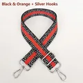 Detail of adjustable orange and black patterned woven strap with silver swivel hooks - Black & Orange with Silver Hook