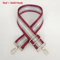 Detail view of red and silver striped woven bag strap with polished gold metal hooks - Red + Gold Hook