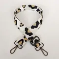 Close-up of leopard pattern strap with gold metallic thread and gunmetal hooks - White + Gunmetal Hook