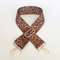 Detail of leopard print wide bag strap showing adjustable gold-tone metal buckles - No.6 + Gold Hook