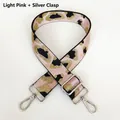 Detail of light pink leopard print woven strap with silver swivel hooks and adjustable buckle - Light Pink + Silver Hook