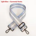 Detail of light blue striped bag strap with gunmetal swivel hooks and adjustable buckle - Light Blue + Gunmetal Hook