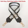 Close-up of dark gray nylon strap with silver wire and adjustable golden metal hooks - Dark Gray With Dark Gray Leather Trim and Gold Hook
