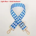 Detail of light blue houndstooth woven shoulder strap with gold metal hooks and buckle - Light Blue + Gold Hook