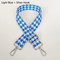 Close-up of light blue houndstooth jacquard bag strap with silver metal swivel hooks - Light Blue + Silver Hook