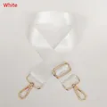 Detail view of adjustable white nylon strap with polished gold-tone metal lobster clasps - White