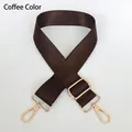 Macro view of adjustable coffee nylon strap with polished light gold metal hooks - Brown