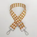Detail view of houndstooth jacquard bag strap in yellow brown with silver metal hooks - Yellow Brown + Silver Hook