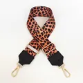 Close-up of leopard print bag strap with adjustable gold buckle and black leather ends - Classic Leopard Print Webbing (No. 7)