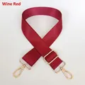 Detail of adjustable wine red nylon bag strap with polished gold metal swivel hooks - Burgundy