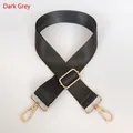 Detail of adjustable dark grey nylon strap with polished gold-tone metal snap hooks - Dark Gray