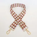 Close-up of houndstooth woven handbag strap with light brown pattern and gold metal hooks - Light Brown + Gold Hook