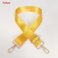Detail of adjustable yellow nylon bag strap with high-density weave and gold metal hooks - Yellow