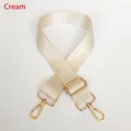 Detail view of the beige nylon bag strap with shiny gold rotating metal hooks - Off White