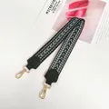 Detail of green ethnic woven wide shoulder strap with gold metal hooks and leather tips - Green + Gold Hook