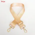 Detail of adjustable beige nylon strap with polished light gold metal swivel hooks - Beige