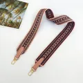 Detail view of 5cm wide pink woven canvas bag strap with geometric arrow pattern and gold hooks - 5cm / Pink + Pink (Silver Hook)