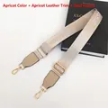 Detail of apricot nylon bag strap with gold metal hooks and Fashion Classic embroidery - Apricot + Apricot Leather