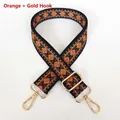 Close-up of orange diamond pattern canvas strap with adjustable gold lobster buckles - Orange + Gold Hook