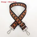 Detail of adjustable thick canvas bag strap featuring orange diamond jacquard and silver clips - Orange + Silver Hook
