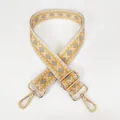Detail view of yellow geometric woven bag strap with golden metal lobster clasps - Yellow + Gold Hook