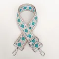 Detail of silver swivel hooks and thick woven canvas strap with green geometric pattern - Pattern B13 + Silver Hardware