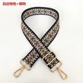 Detail view of woven diamond pattern bag strap with silver metal swivel hooks - White Edge Brown + Silver Hooks