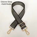 Detail of adjustable black and gold arrow pattern woven strap with golden metal hooks - Gold Arrow & Gold Hook