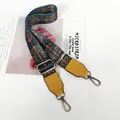 Detail of adjustable woven strap with vintage pattern and bronze metal hooks - Mosaic Print Yellow Leather