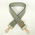 Detail of adjustable green and beige geometric diamond pattern canvas shoulder bag strap - Green + Gold Hook