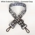 Detail of adjustable white snake print shoulder strap with gunmetal swivel hooks - White Snakeskin + Gunmetal Hook