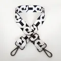 Macro detail of adjustable black and white geometric wide shoulder strap with metal hook - Pattern B59 With Gunmetal Hook