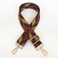 Detail of adjustable geometric canvas bag strap with golden metal hooks and buckles - Brown Yellow + Gold Hooks
