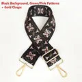 Detail eines breiten Jacquard-Taschengelenkriemens mit grün-rosa Blumenmuster und Goldhaken - Schwarze Basis Grün Pink + Goldener Haken