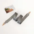 Detail of grey fabric replacement strap with gold metal hooks and leather reinforced ends - Grey + Grey Leather + Gold Hook