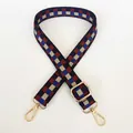 Dettaglio della tracolla regolabile in tela a scacchi con fibbie in metallo dorato - Blu Rosso Mattone + Ganci Oro